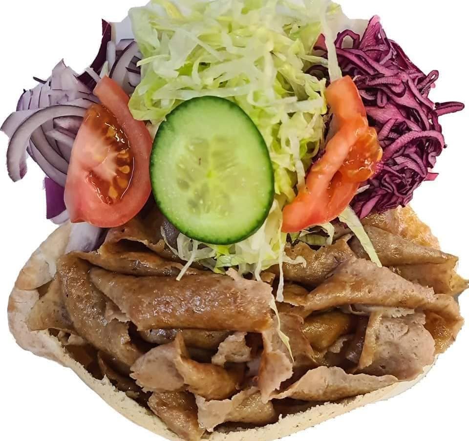 Doner kebab in pitta bread with fresh salad from Beddau Charcoal Grill